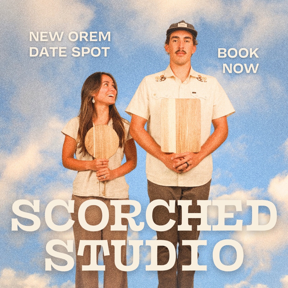 Scorched Studio ad with couple against a painted sky