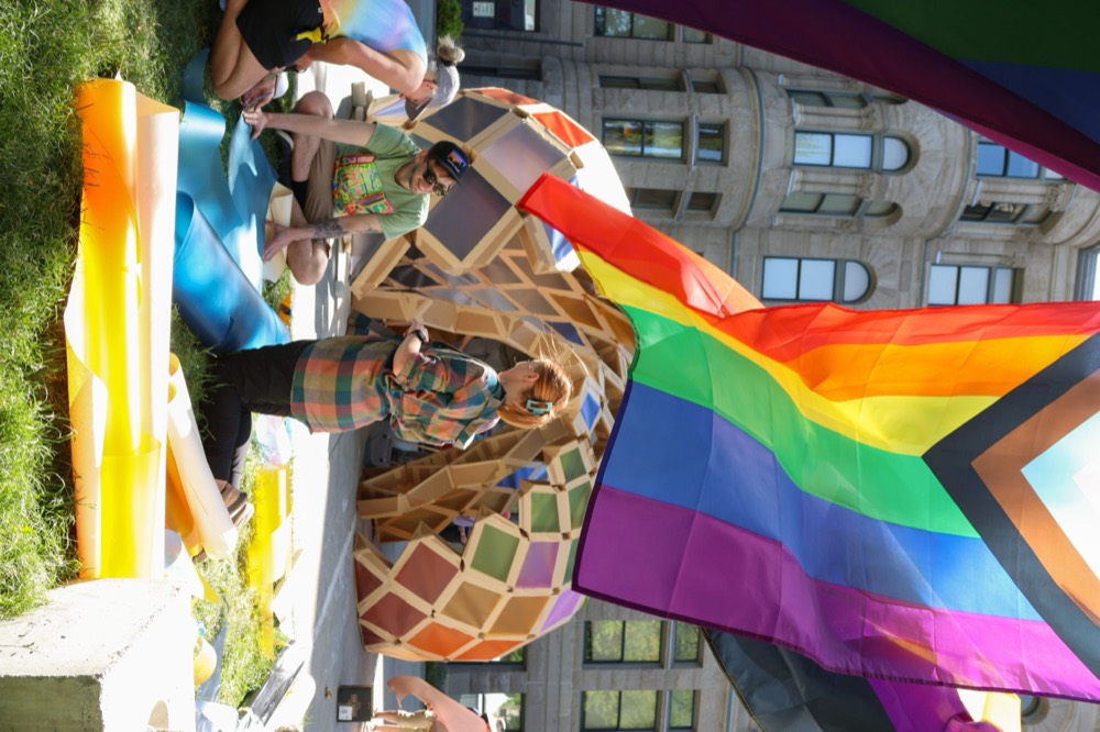 Sanctuary Documentary shoot — pride flag over the pavilion build