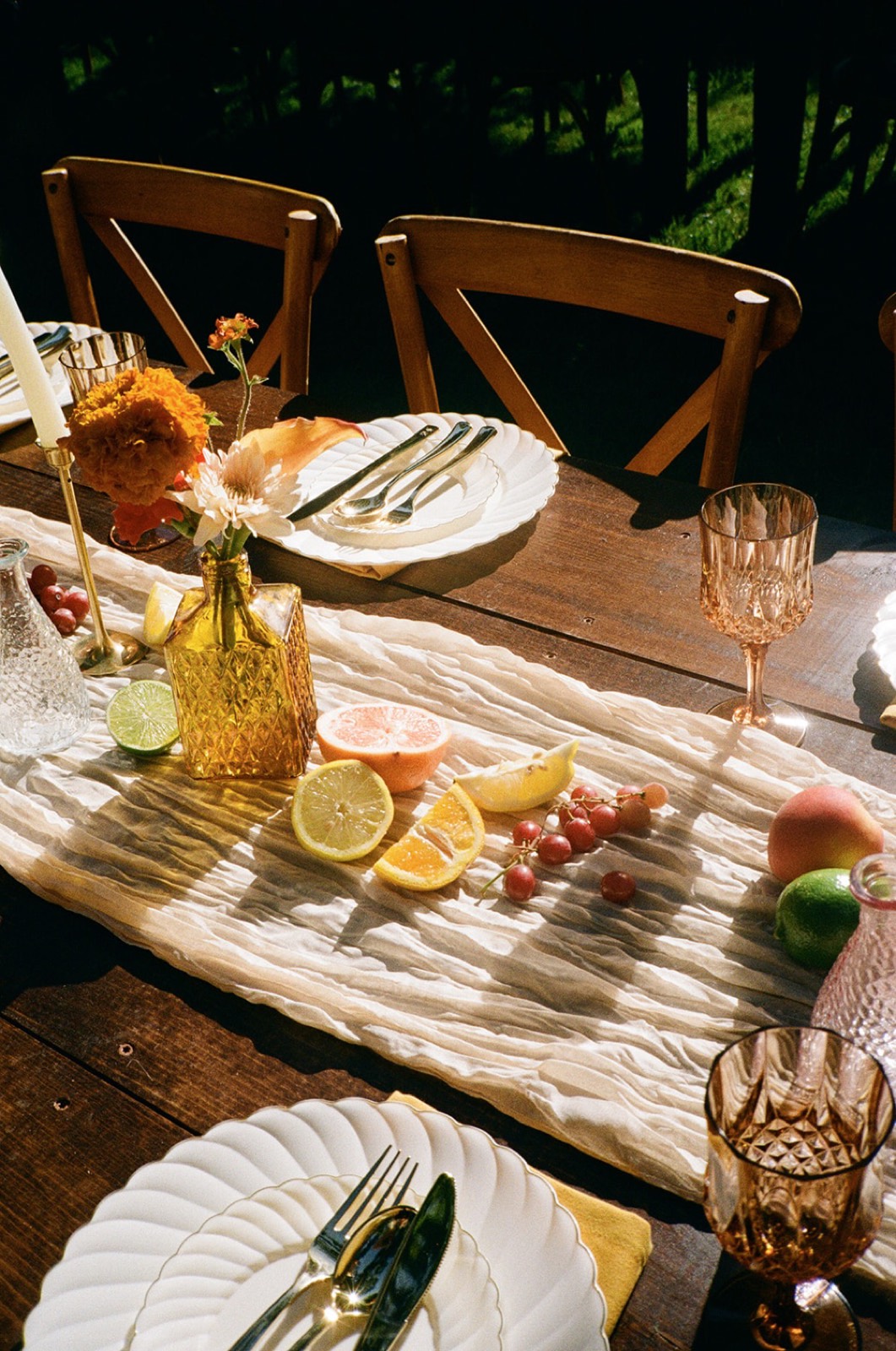 Table runner with sliced citrus and grapes