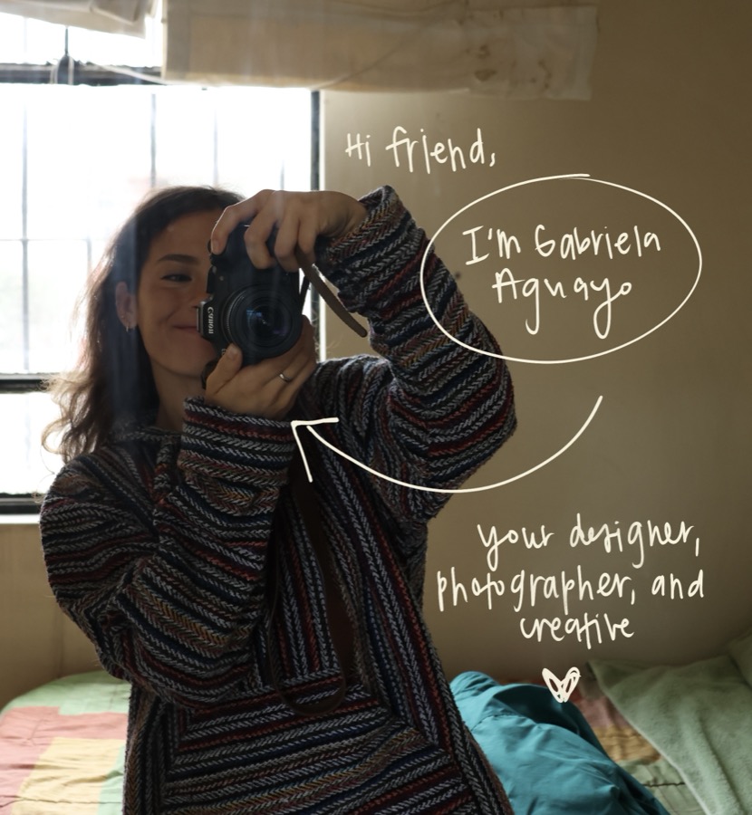 Gabriela with a camera, beside a handwritten hello: I'm Gabriela Aguayo, your designer, photographer and creative