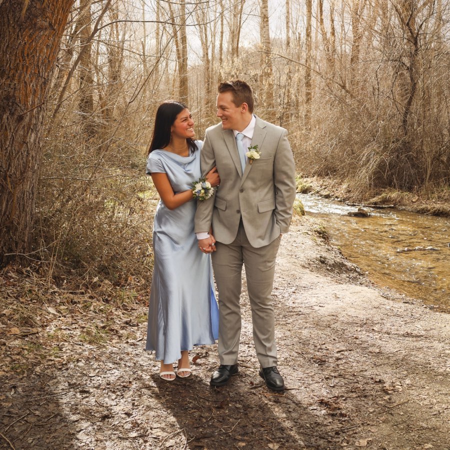 Kiara and her date on a wooded trail